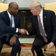 President Donald Trump shakes hands with Sen. Tim Scott (R-SC) during a working session regarding the Opportunity Zones provided by tax reform in the Oval Office of the White House February 14, 2018.